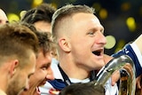 Berisha celebrates with A-League trophy