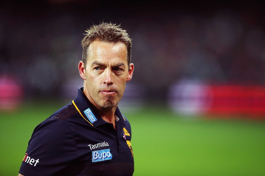 Hawks coach Alastair Clarkson was harassed by a fan outside his hotel.