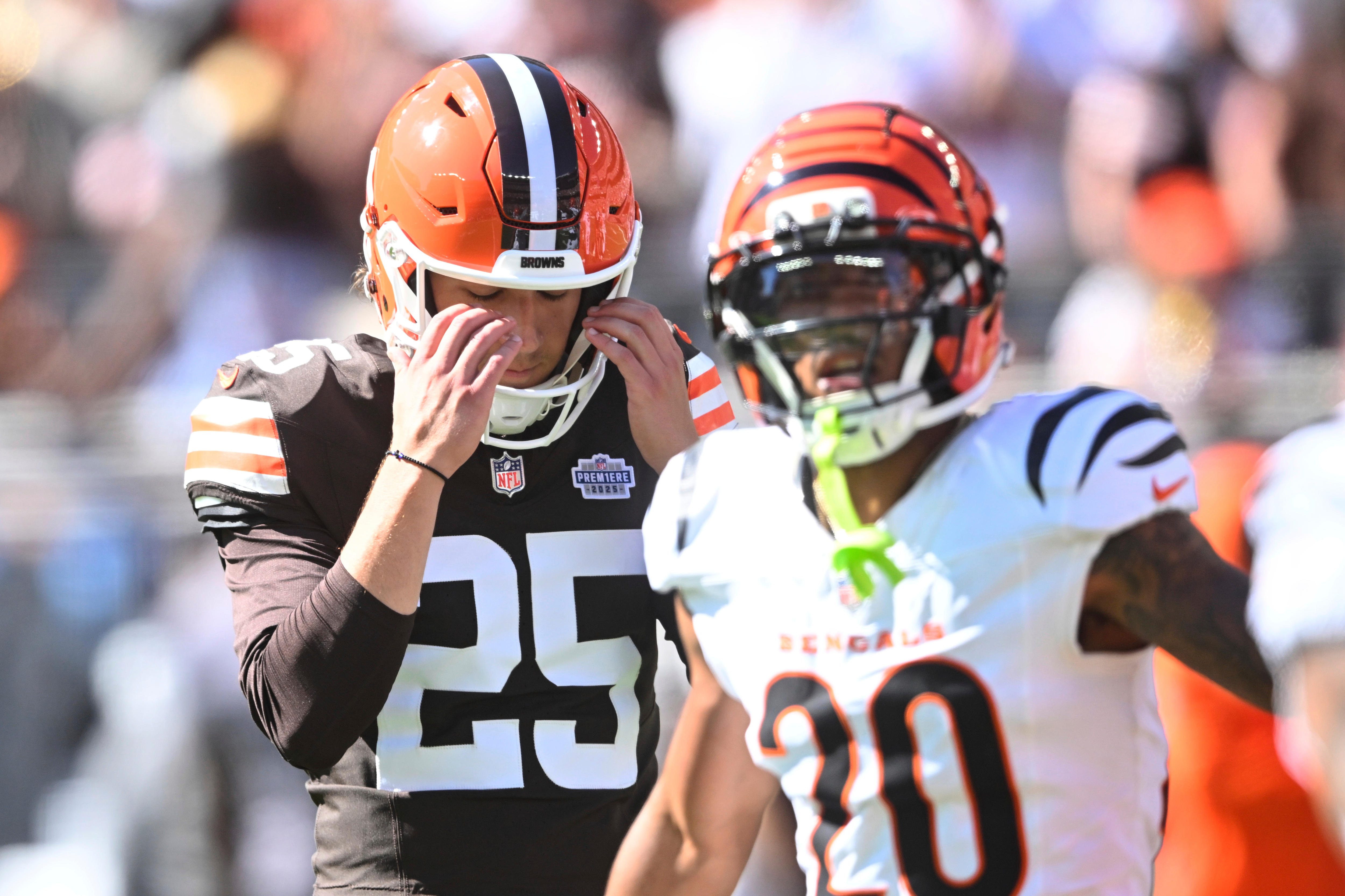 Andre Szmyt holds his head in his hands