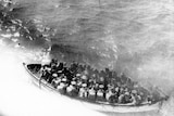 A boatload of 6th Battalion soldiers on their way to land at Anzac Cove after leaving the transport ship HMT Galeka at Gallipoli Peninsula, Turkey on 25 April 1915.