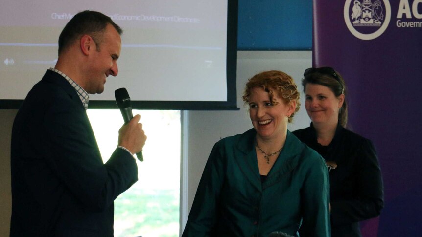 ACT Chief Minister Andrew Barr congratulating ACT scientist of the year, Dr Ceridwen Fraser