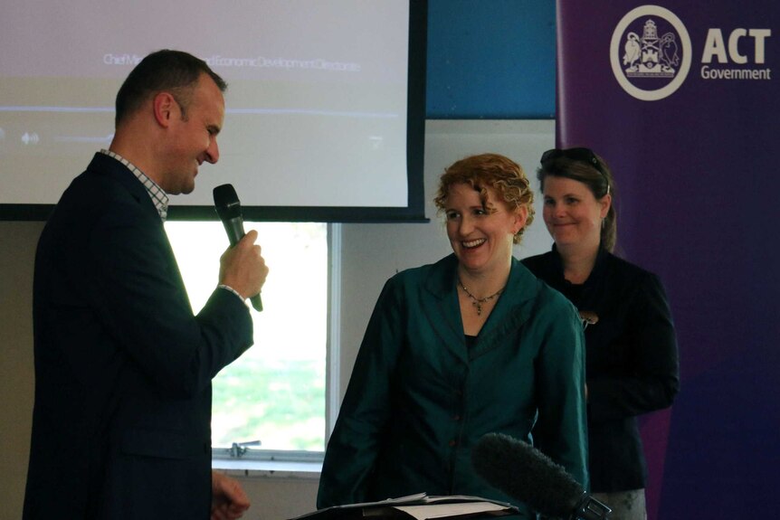 ACT Chief Minister Andrew Barr congratulating ACT scientist of the year, Dr Ceridwen Fraser