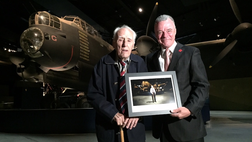 Former bomber pilot Leonard Bence and Australian War Memorial director Brendan Nelson stand in front of the Avro Lancaster