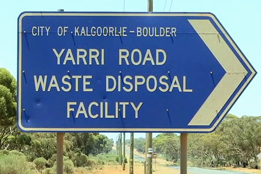 A blue road sign which says Yarri Road Waste Disposal Facility.