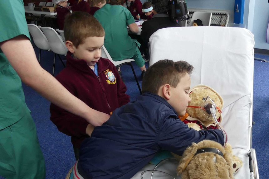 Student hugs a teddy bear