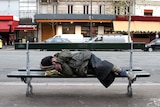 A homeless person sleeps rough