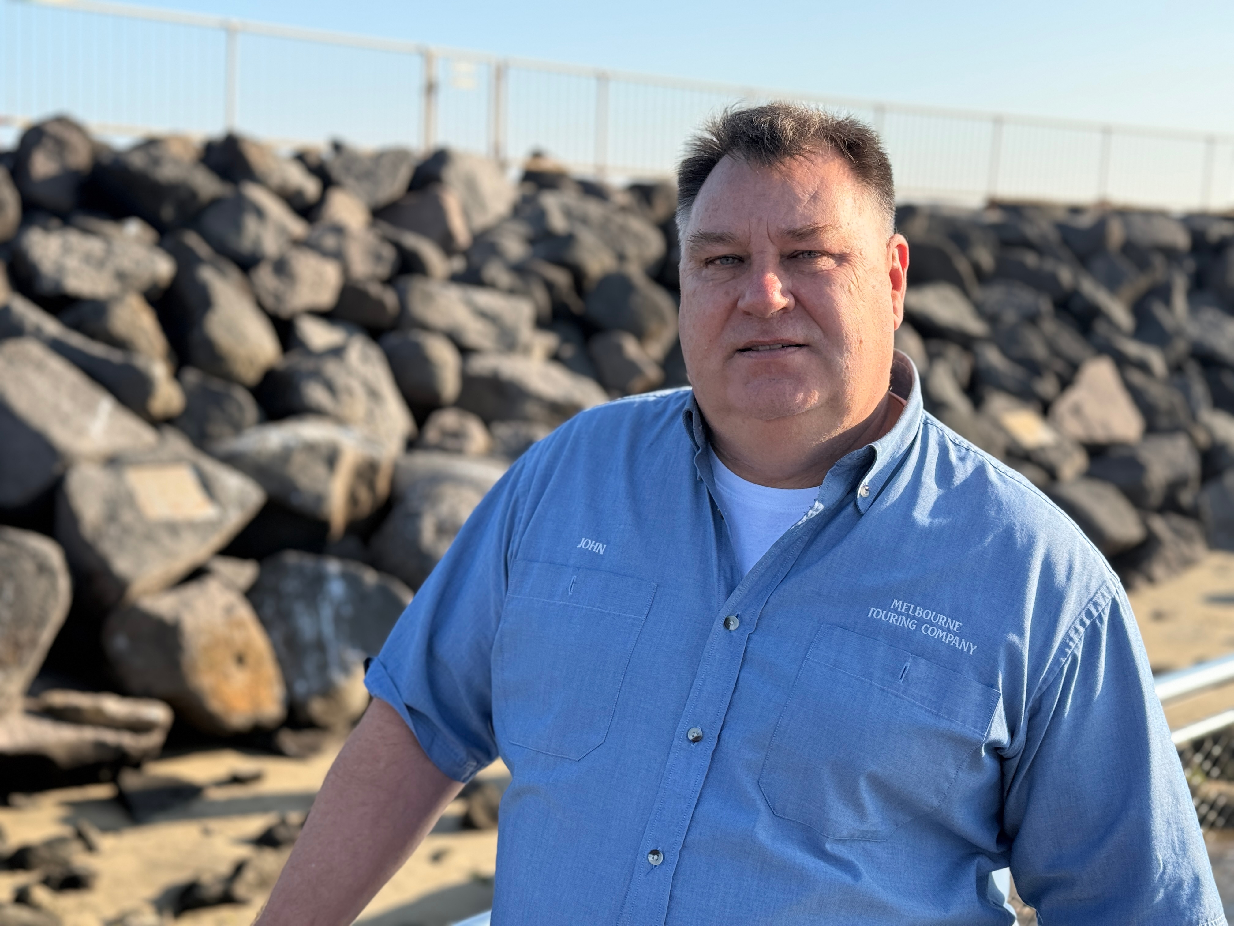 Tourism operator John Stapleton stands near the St Kilda pier.