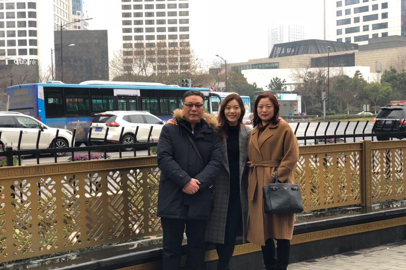 Lingshu Meng posts with her father and mother in Nanjing, China, after travelling home to celebrate Lunar New Year.