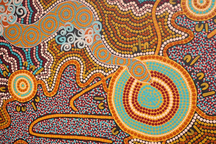 a close up of an aboriginal dot painting including a serpent