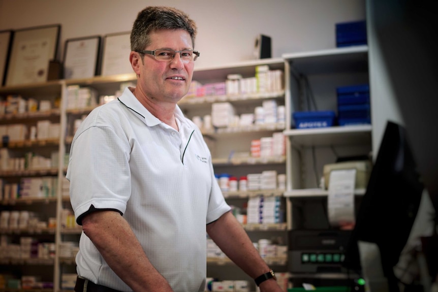 Pharmacist Rhys Jones looks at the camera.