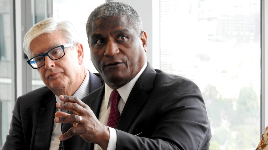 Former US transportation secretary Rodney Slater gestures with his hand as he speaks.