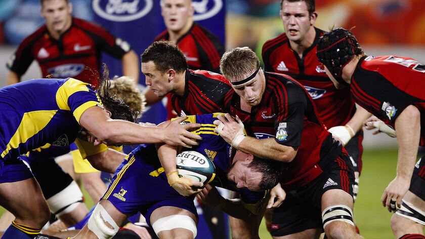 Leading by example: Skipper Craig Newby charges the ball forward for the Highlanders.