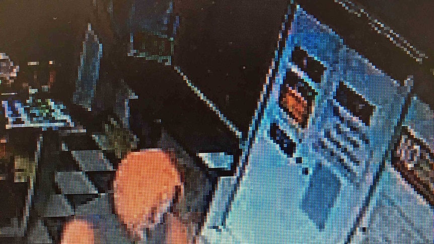 Robbery in progress in Hobart shop