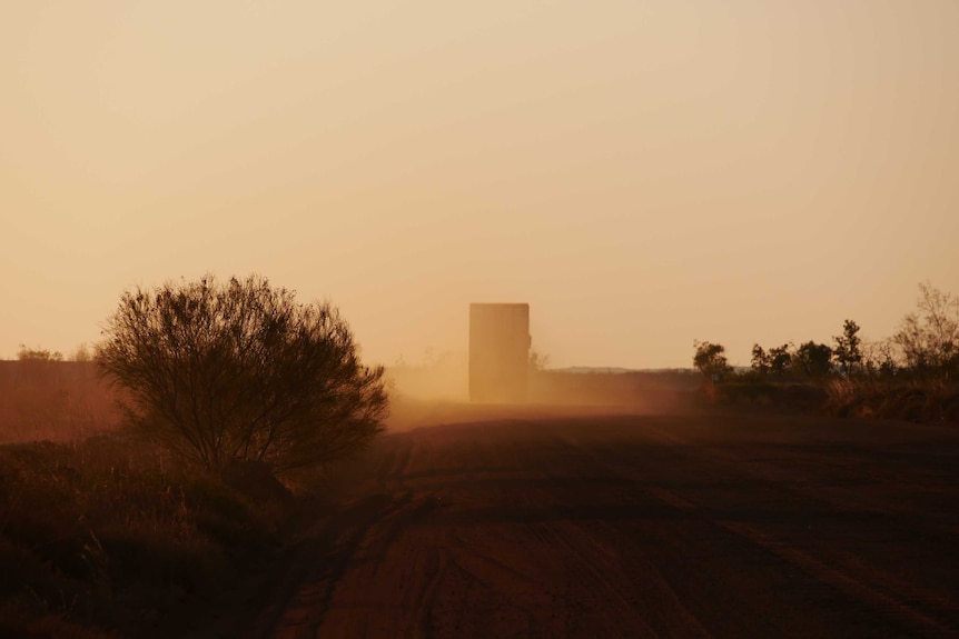 A truck drives away from Balgo on the Tanami road.