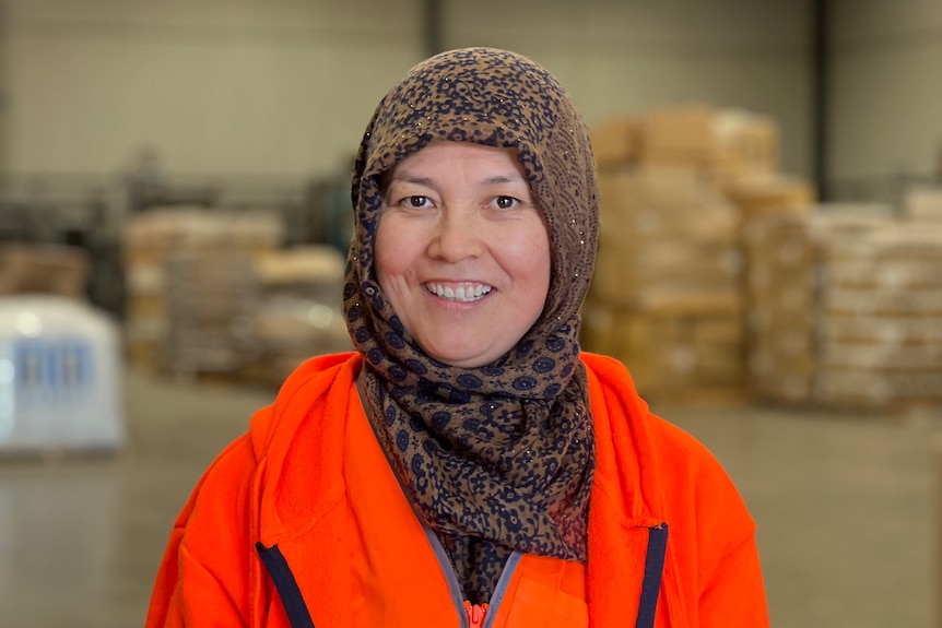 Soghra Jaffari is a migrant worker, image shows her in portrait at the site of her first work place in Australia.