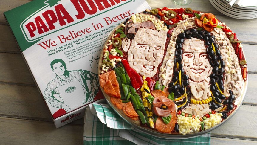 Pizza decorated with Kate and Will's faces