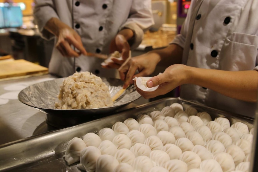 Chefs preparing food.