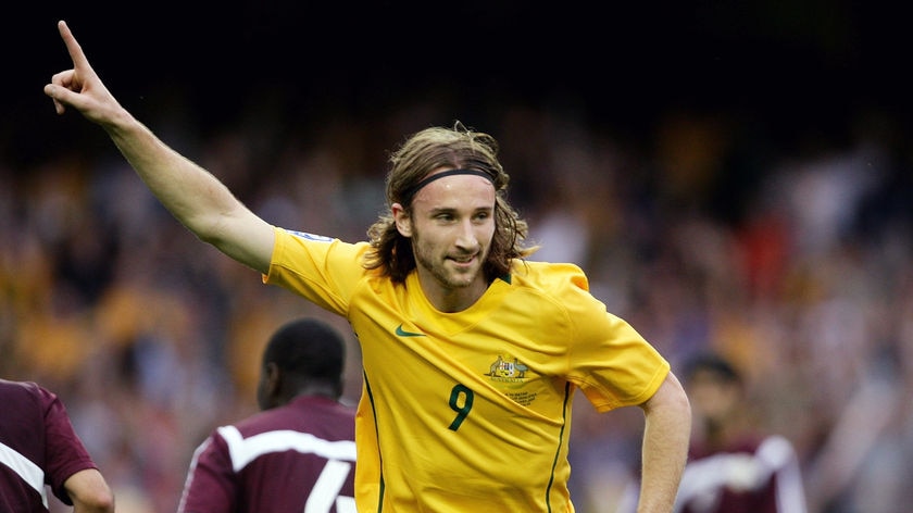 The spree begins... Josh Kennedy celebrates after netting the first against Qatar.