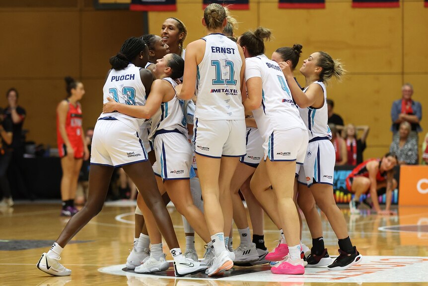 Southside Flyers celebrate defeating Perth Lynx in game two of 2023/24 WNBL grand final series.