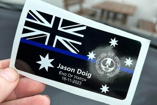 A sticker with the Australian flag and a blue line.