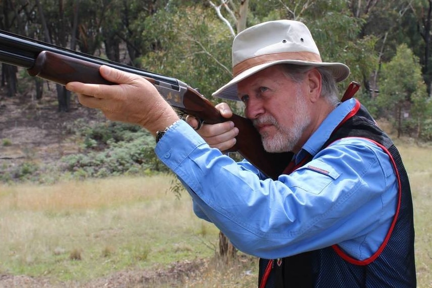 Robert Borsak MLC holding a gun as he prepares to take part in a Clay Target Game Club