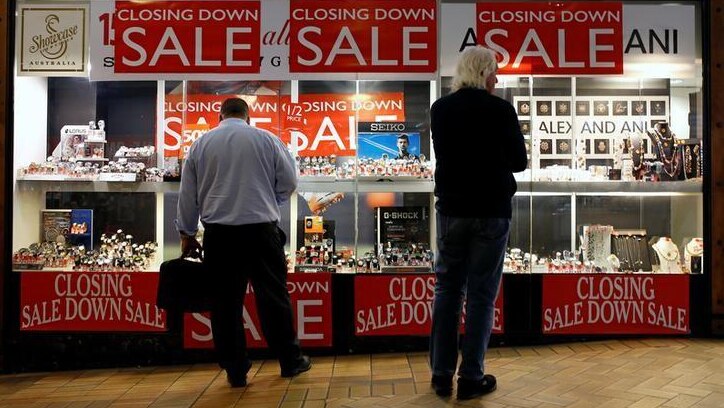 Shoppers look in the window of a retail store selling jewellery in central Sydney