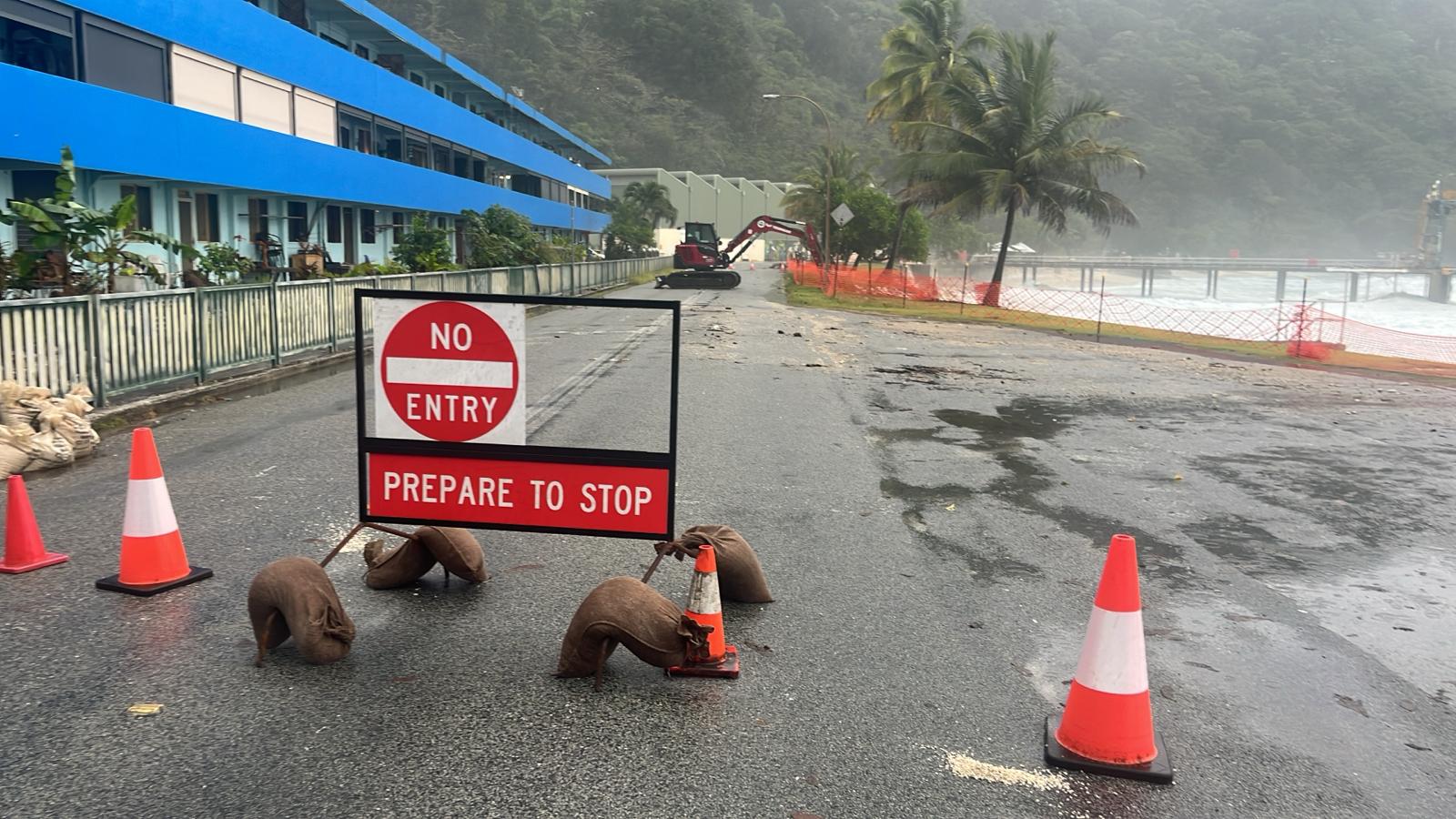 A warning sign at the foreshore of a tropical island.