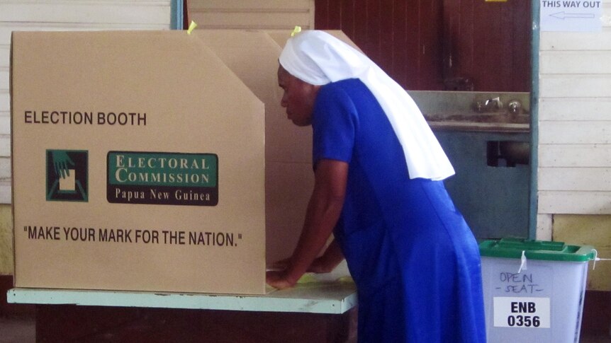 Papua New Guinean nun Sister Susan prepares to cast her ballot at a polling station in Kokopo, East New Britain province