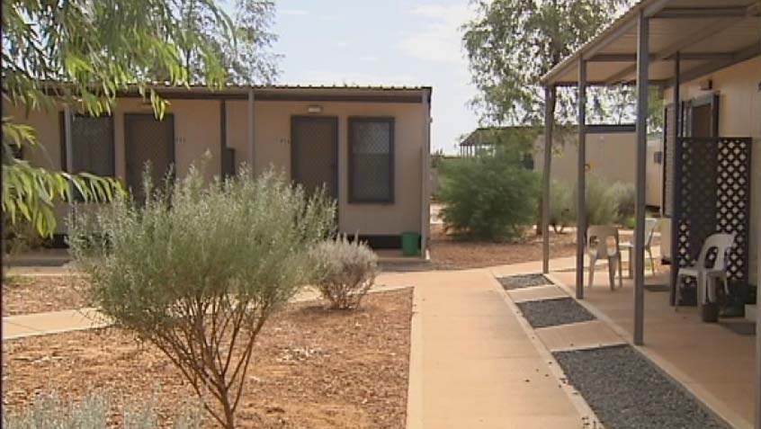 Shrubs and trees surround dongas in the Pilbara