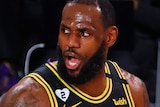 LeBron James looks to the right and opens his mouth