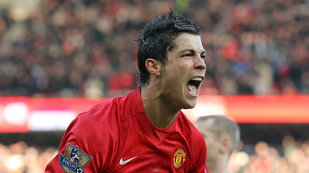 Manchester United star Cristiano Ronaldo celebrates after scoring his second goal against Everton