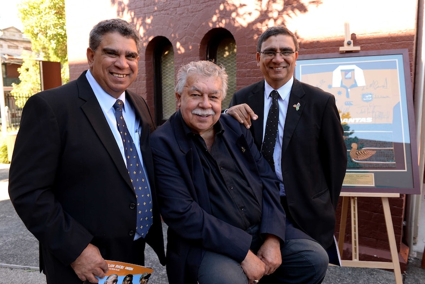 Glen Ela, Lloyd McDermott and Gary Ella pose for a photo in 2013.