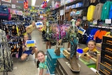 Children with Ukraine flag in outback store