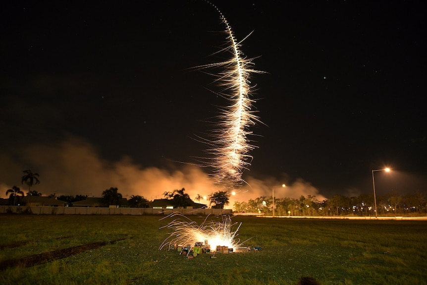 A firework shoots through the air in Johnston