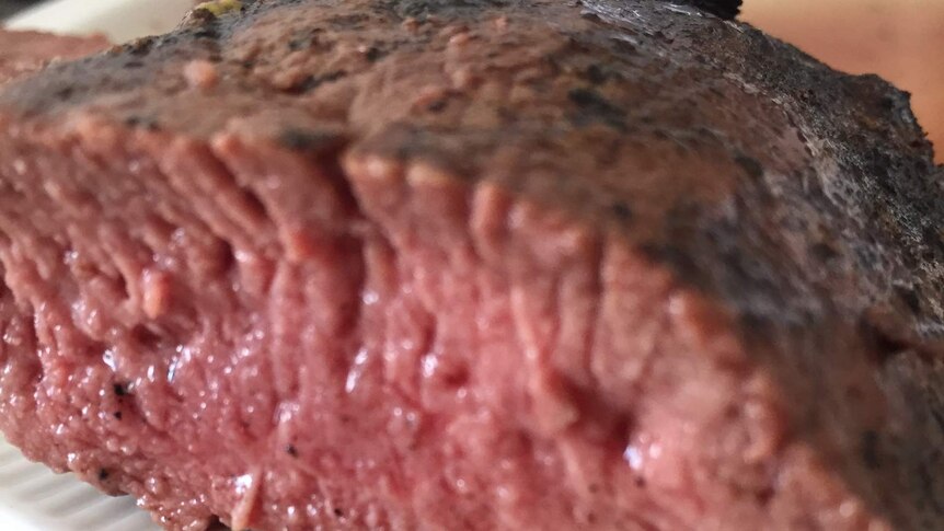 An up close image of a piece of cooked merino mutton back strap