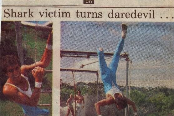 Archival newspaper story of athlete with lower leg amputated doing trapeze stunts