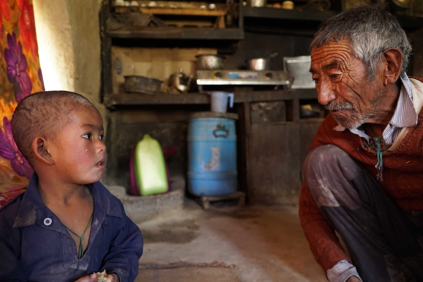 A boy and adult near Chadar trek