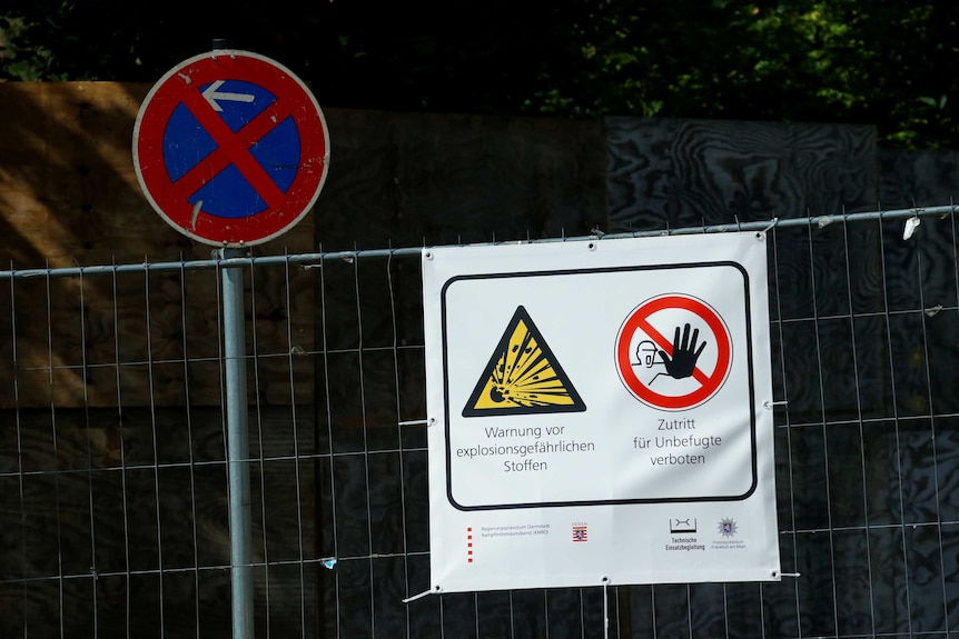 A German warning sign ahead of the controlled explosion