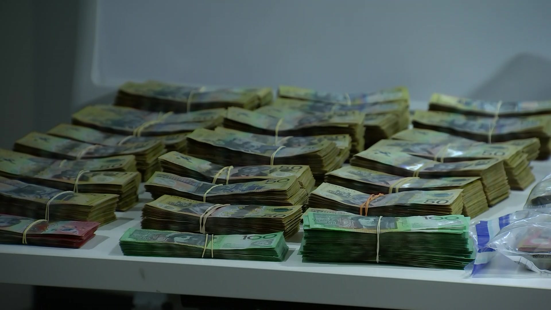 Cash in rubber bands on a table