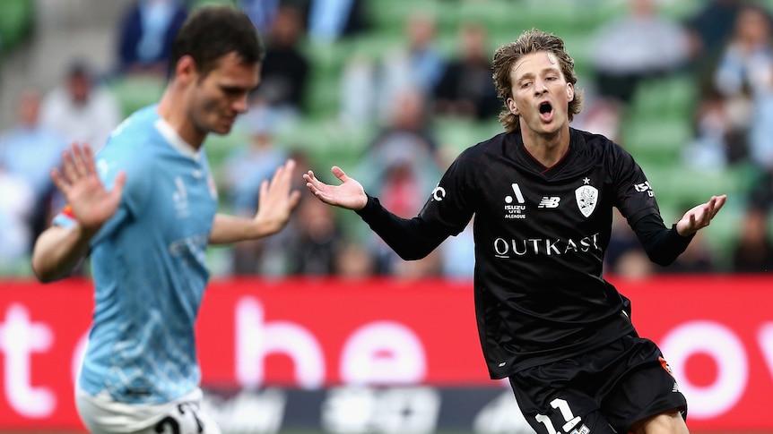 A Brisbane Roar A-League Men player reacts after missing a shot on goal against Melbourne City.