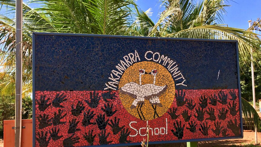 Exterior of Yakanarra School, sign with name and trees