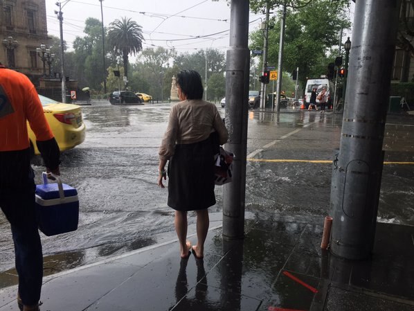 Drenched woman on Collins Street