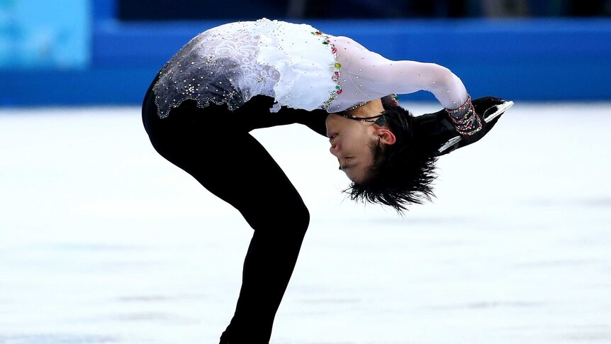 Golden performance ... Yuzuru Hanyu competes during the free skating program