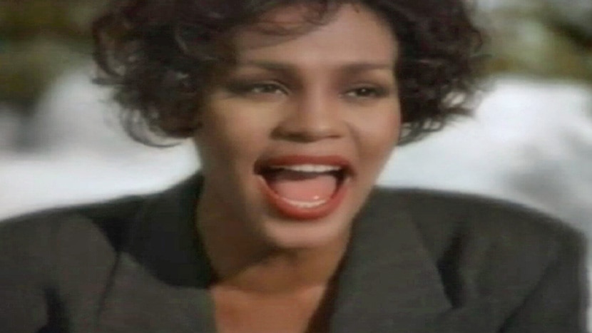 Whitney Houston singing I will always love you in music video