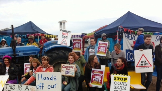 Protesters use a tractor to block access to a CSG test drill at Fullerton Cove