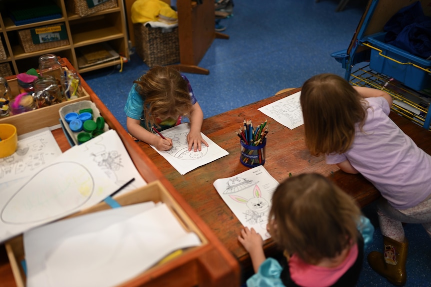 children drawing and playing at daycare