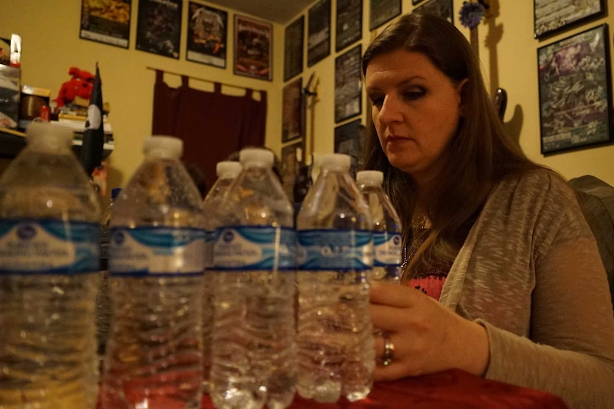 Melissa Mays with water samples to send for testing