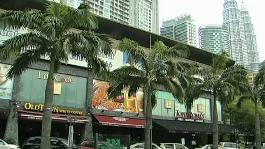 KL Coffee shop with skyscrapers in the background