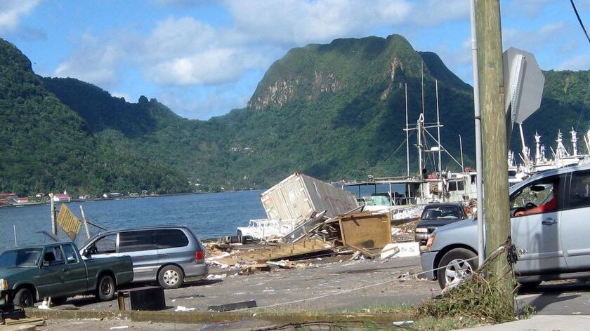 Debris lie at the edge of the harbour in Pago Pago