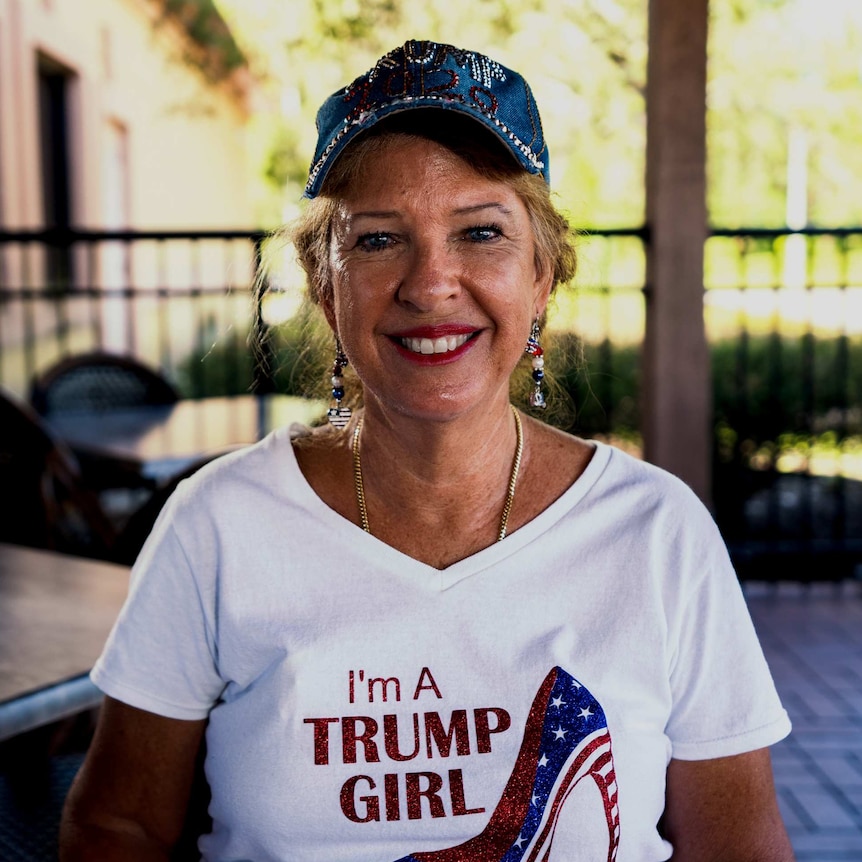 A woman wearing a t-shirt reading 'I'm a Trump girl'